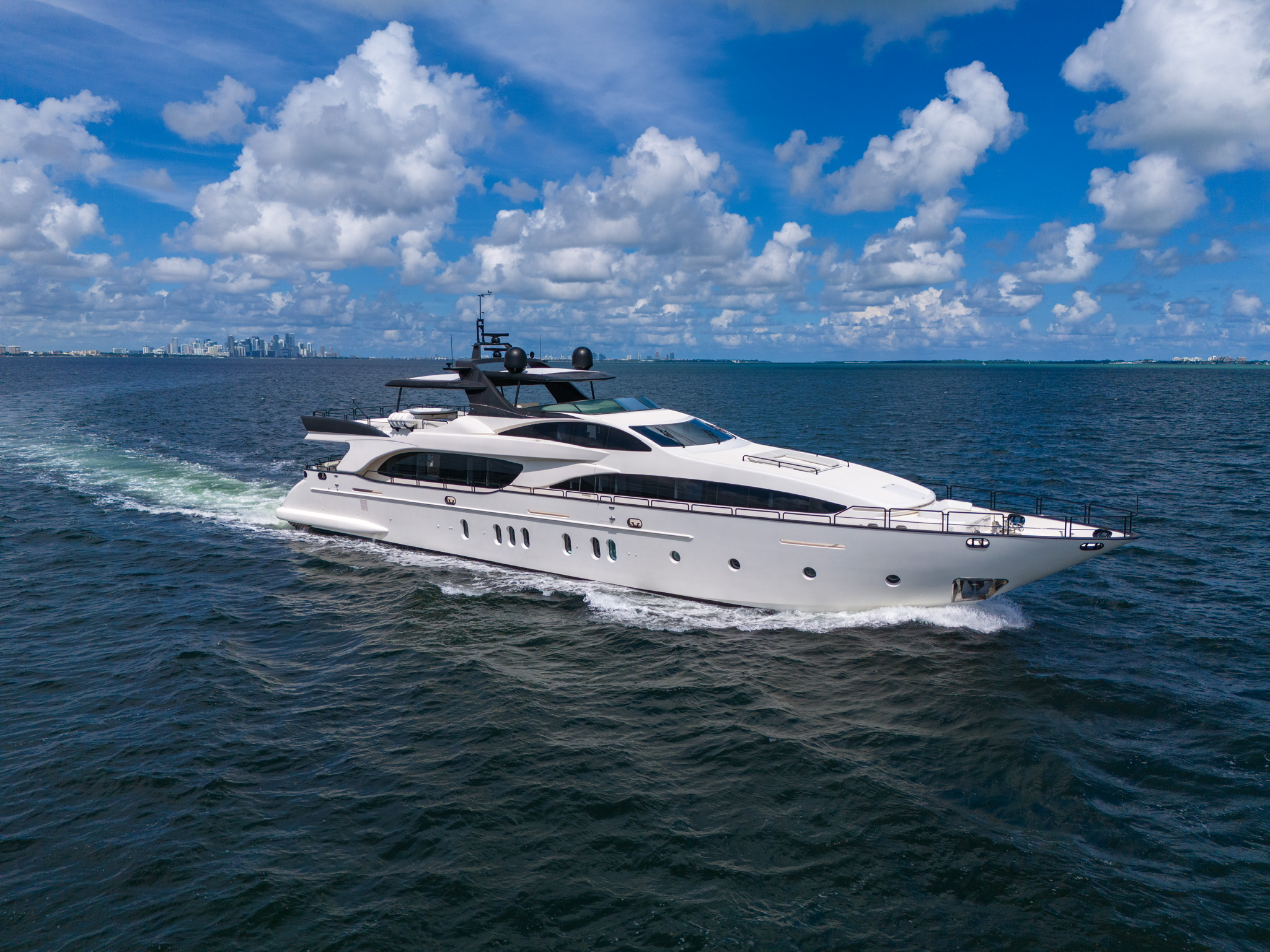 Azimut Infinity 130 cruising by the Miami skyline