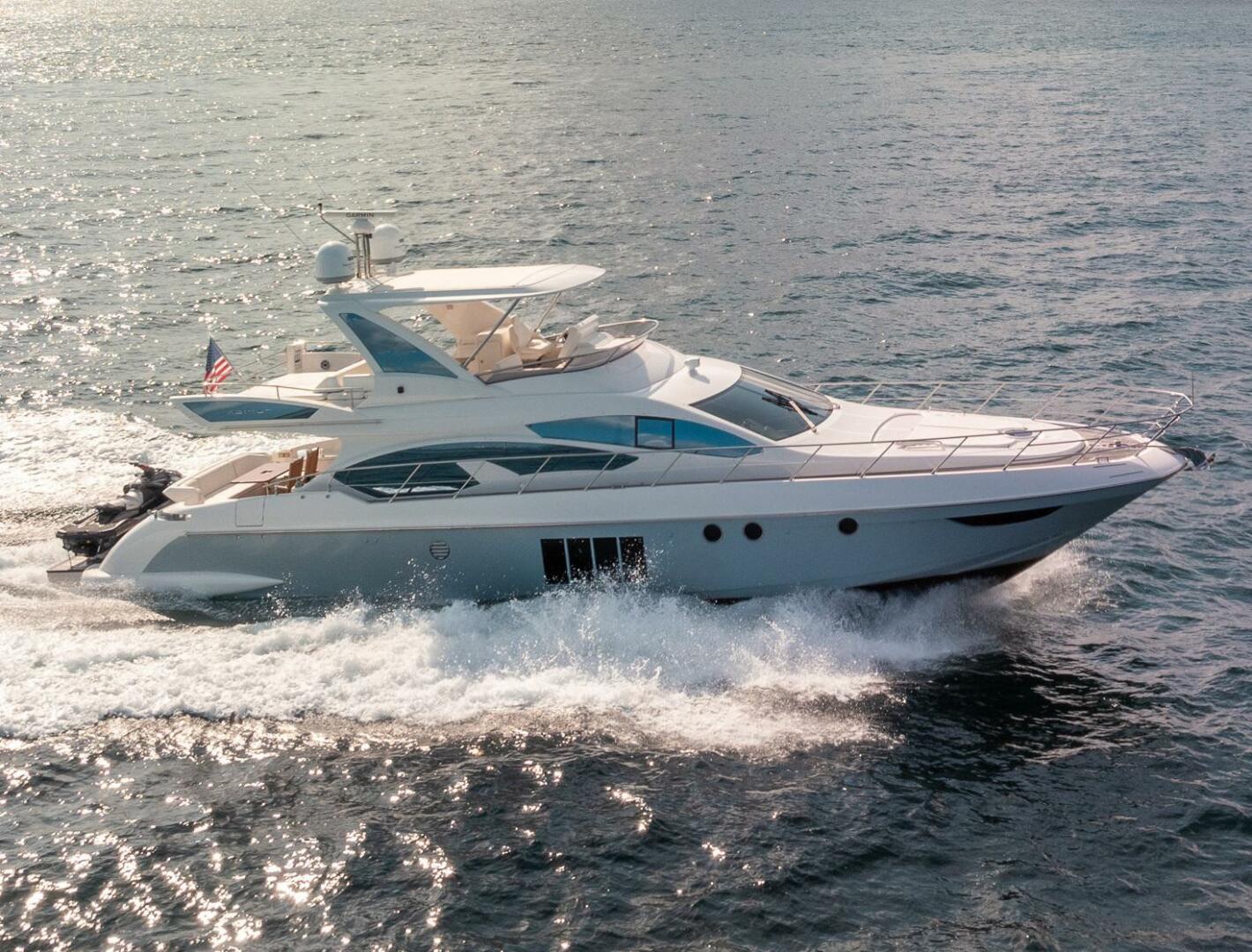 Azimut 70 Warrior II cruising near Miami with skyline backdrop
