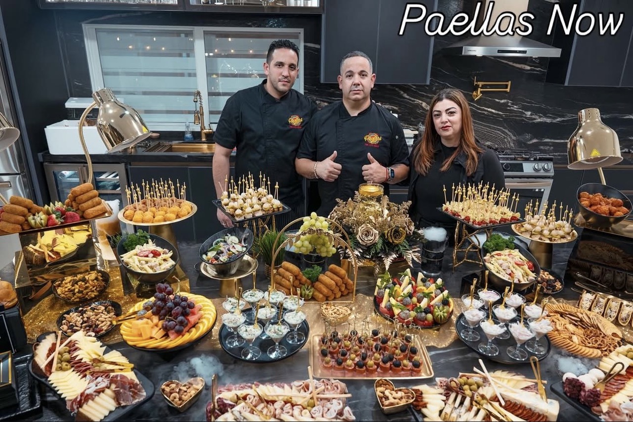 Seafood paella simmering in a large pan on a yacht