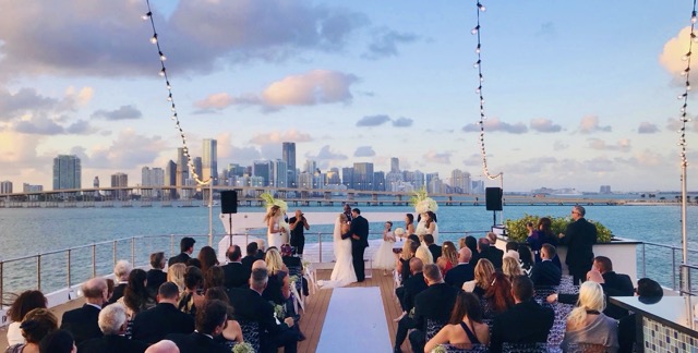 Cocktail hour on the bow with guests mingling