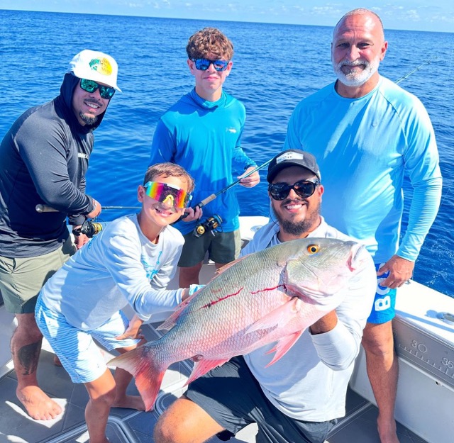 Close-up of rod and reel during a fishing charter
