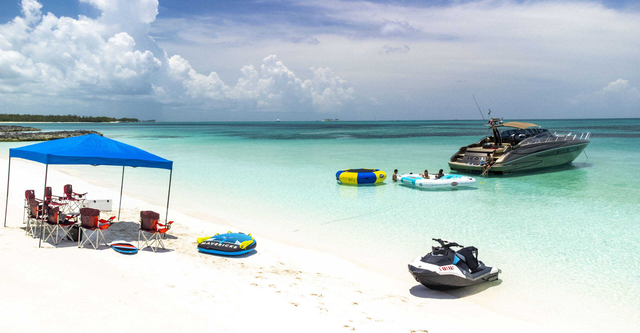 Aerial of yacht crossing deep-blue water en route to the Bahamas