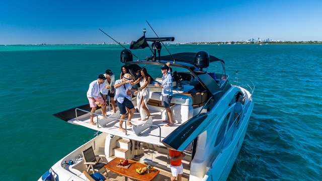 Drone view of yacht cruising near Bayside and MacArthur Causeway