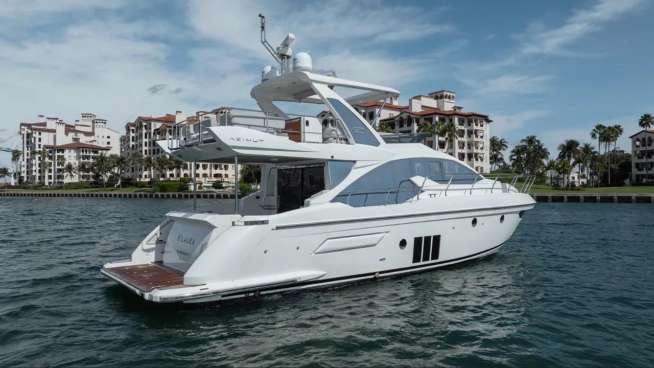 Azimut 50 ft - Bimini Charters 6 Bow sunpads β skyline backdrop